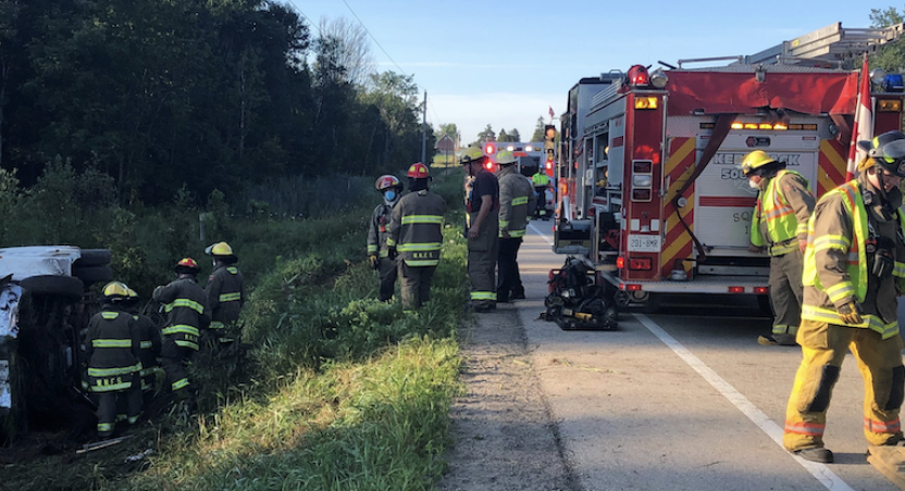 firefighters attending a car accident