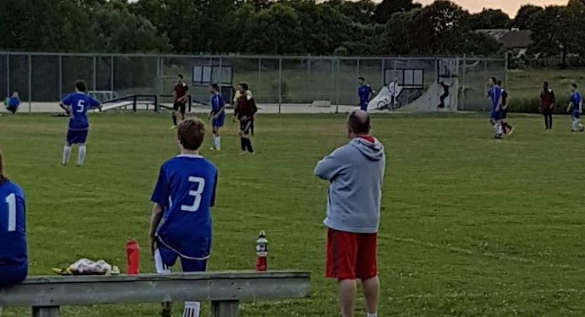 soccer players on the bench