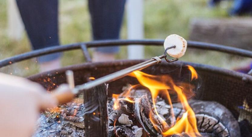 roasting marshmallow on an open fire