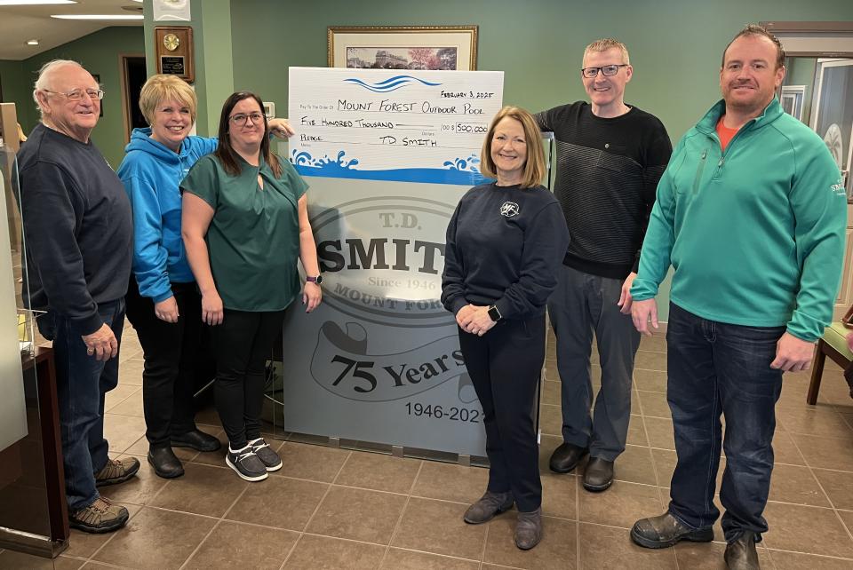 T.D. Smith Transport presents the Mount Forest Aquatics Ad-Hoc Advisory Committee with a cheque for $500,000.