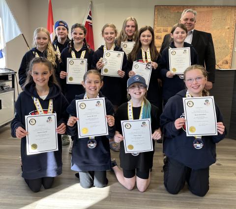 Members of the Mount Forest Rams U11B girls hockey team with Mayor Andy Lennox.